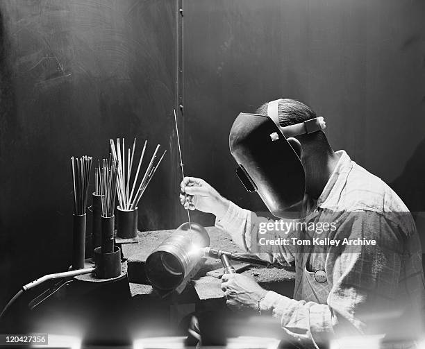 welder working on metal pipe - steel worker stock pictures, royalty-free photos & images