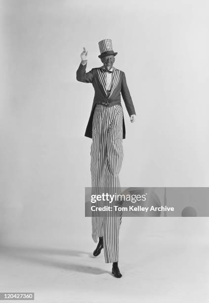 man walking on stilts, smiling, portrait - 1961 stock pictures, royalty-free photos & images