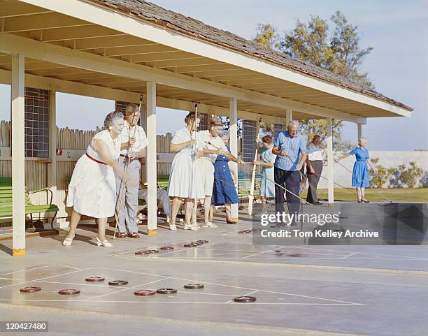 senior people playing shuffleboard - 1963 stock pictures, royalty-free photos & images