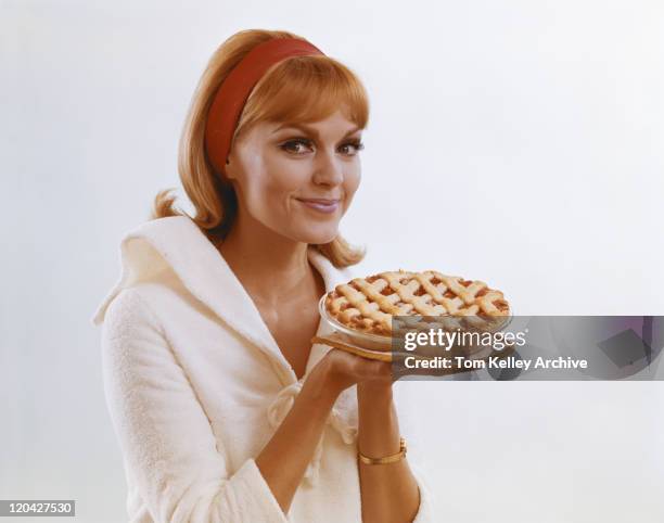 young woman holding dessert pie against white background, portrait - 1966 bildbanksfoton och bilder