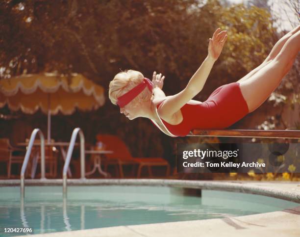 young woman with blindfold balancing on diving board - woman diving board stock pictures, royalty-free photos & images