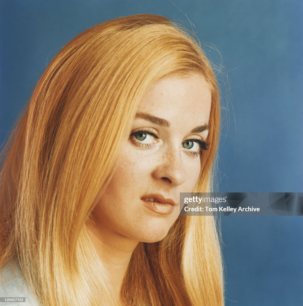 Young woman grimacing, close-up