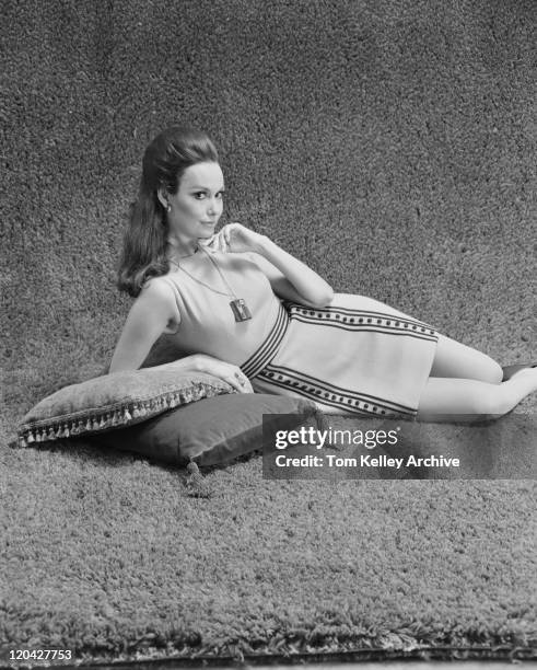 young woman leaning on cushions, portrait - 1969 stock pictures, royalty-free photos & images