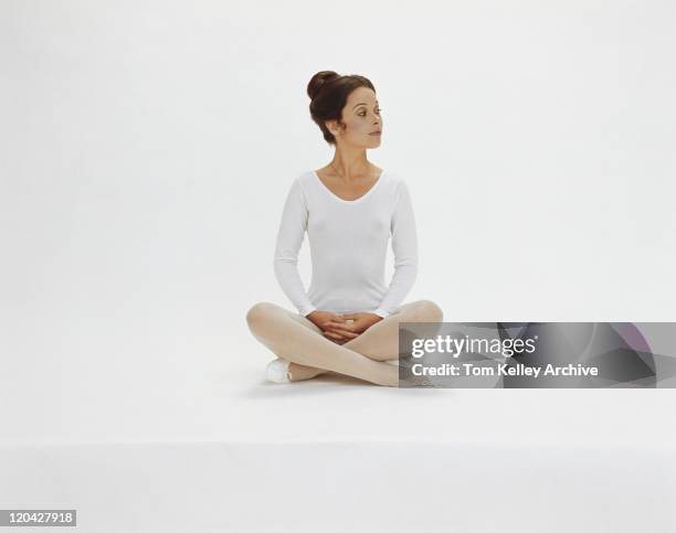 woman in leotard sitting on white background - 1974 stock pictures, royalty-free photos & images