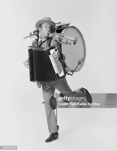 mature man playing variety of musical instruments on white background, portrait - cymbal stock pictures, royalty-free photos & images