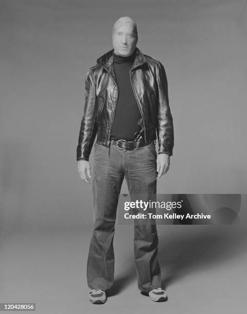 criminal standing on grey background, portrait - 1983 stock pictures, royalty-free photos & images