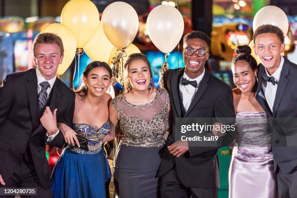 group of multi-racial teenagers having fun at prom - prom dress stock pictures, royalty-free photos & images