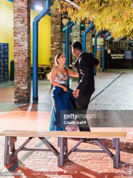 multi-ethnic teenage couple at prom, dancing alone - prom dancing stock pictures, royalty-free photos & images