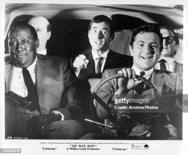 Marty Ingels tells Sid Caesar to quiet as Godfrey Cambridge tries to stay awake. Seated on Sid's left and right are Harry and Joe Possum in a scene...