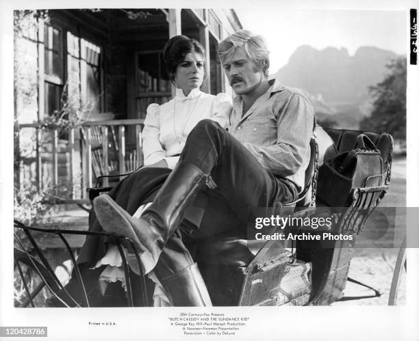 Katharine Ross sitting with Robert Redford in a scene from the film 'Butch Cassidy And The Sundance Kid', 1969.