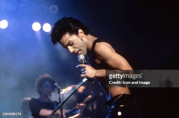 American singer, songwriter, musician, record producer, dancer, actor, and filmmaker Prince performs onstage during his 1986 Parade Tour on June 7 at...