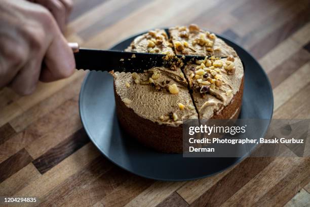 cutting a cake with a knife - cake slices stock pictures, royalty-free photos & images