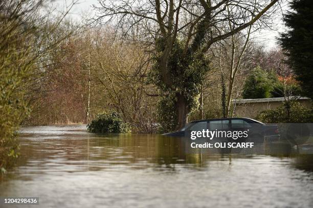 Car floats in flood water in Snaith, northern England on March 1, 2020 after Storm Jorge brought more rain and flooding to parts of the UK. -...