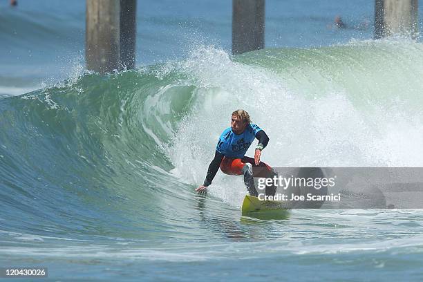 Tanner Gudauskas of USA in the slot of a small wave during his heat against Kelly Slater of USA and Taj Burrow of Australia during the Nike US Open...