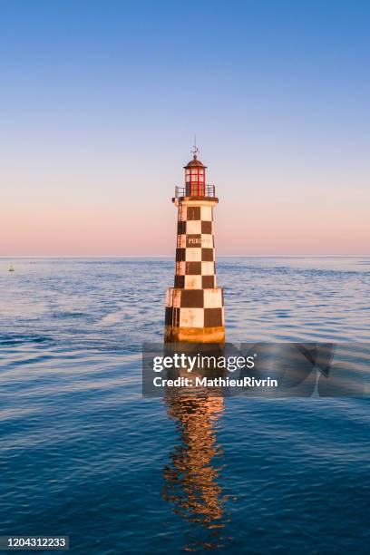 aerial view of the sunset in loctudy in the front of "perdrix" lighthouse - brest brittany stock pictures, royalty-free photos & images