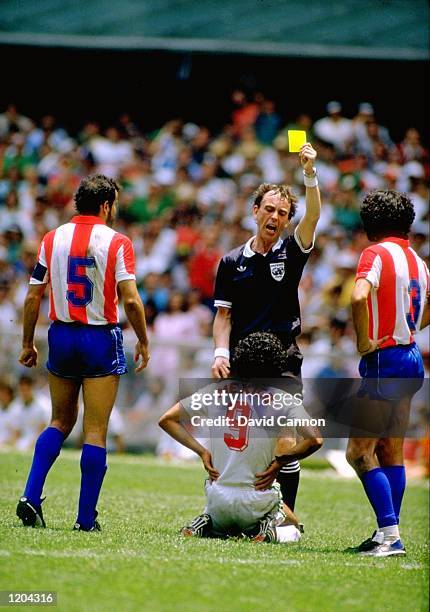 Hugo Sanchez of Mexico is booked in the World Cup match against Paraguay played in Mexico City, Mexico. The match finished in a 1-1 draw. \ Mandatory...