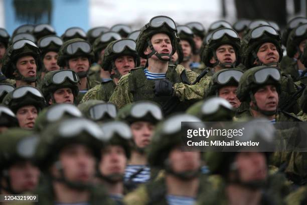 Russian paratroopers march and sing during the military parade at the 76th Guards Air Assault Division in Pskov, Russia, March 2020. Putin is having...