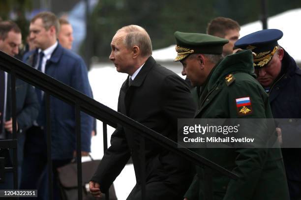 Russian President Vladimir Putin and Defence Minister Sergei Shoigu seen during the military parade at the 76th Guards Air Assault Division in Pskov,...