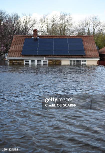 Flood water surrounds houses and residential properties in Snaith, northern England on March 1, 2020 after Storm Jorge brought more rain and flooding...