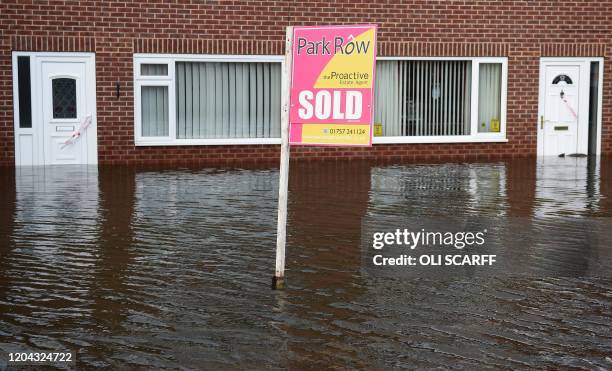 Flood water surrounds houses and properties in Snaith, northern England on March 1, 2020 after Storm Jorge brought more rain and flooding to parts of...