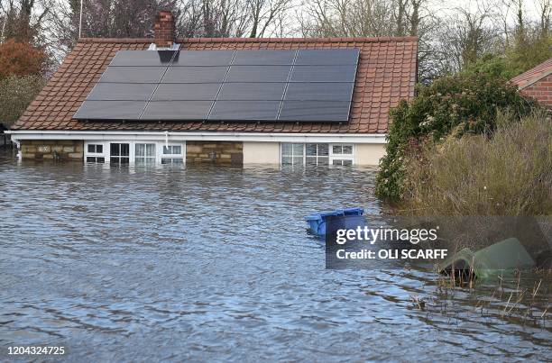 Flood water surrounds houses and properties in Snaith, northern England on March 1, 2020 after Storm Jorge brought more rain and flooding to parts of...