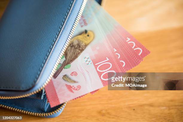 new zealand dollar banknotes and credit card in wallet - new zealand exchange stock pictures, royalty-free photos & images