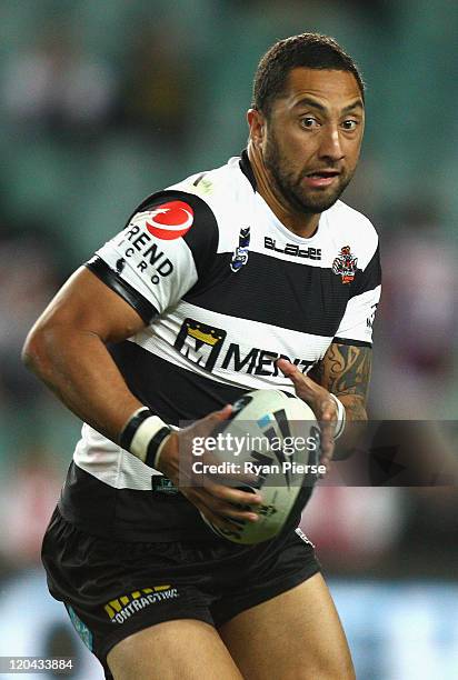 Benji Marshall of the Tigers runs with the ball during the round 22 NRL match between the Wests Tigers and the St George Illawarra Dragons at Sydney...