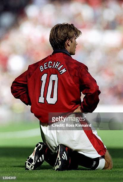 David Beckham of Manchester United kneels on the ground during an FA Carling Premiership match against Blackburn Rovers at Old Trafford in...