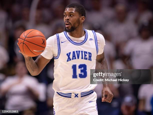 Naji Marshall of the Xavier Musketeers brings the ball up court against the Villanova Wildcats at Cintas Center on February 22, 2020 in Cincinnati,...