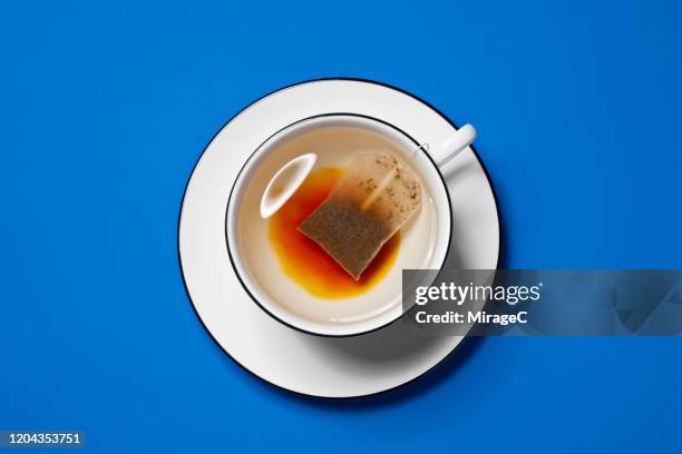 brewing black tea bag 2/5 - cup of tea from above stock pictures, royalty-free photos & images