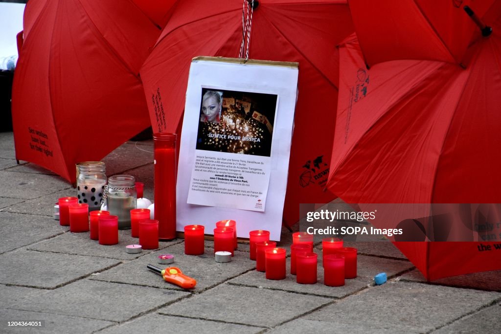 Candles lit in front of a portrait of Jessyca Sarmiento...
