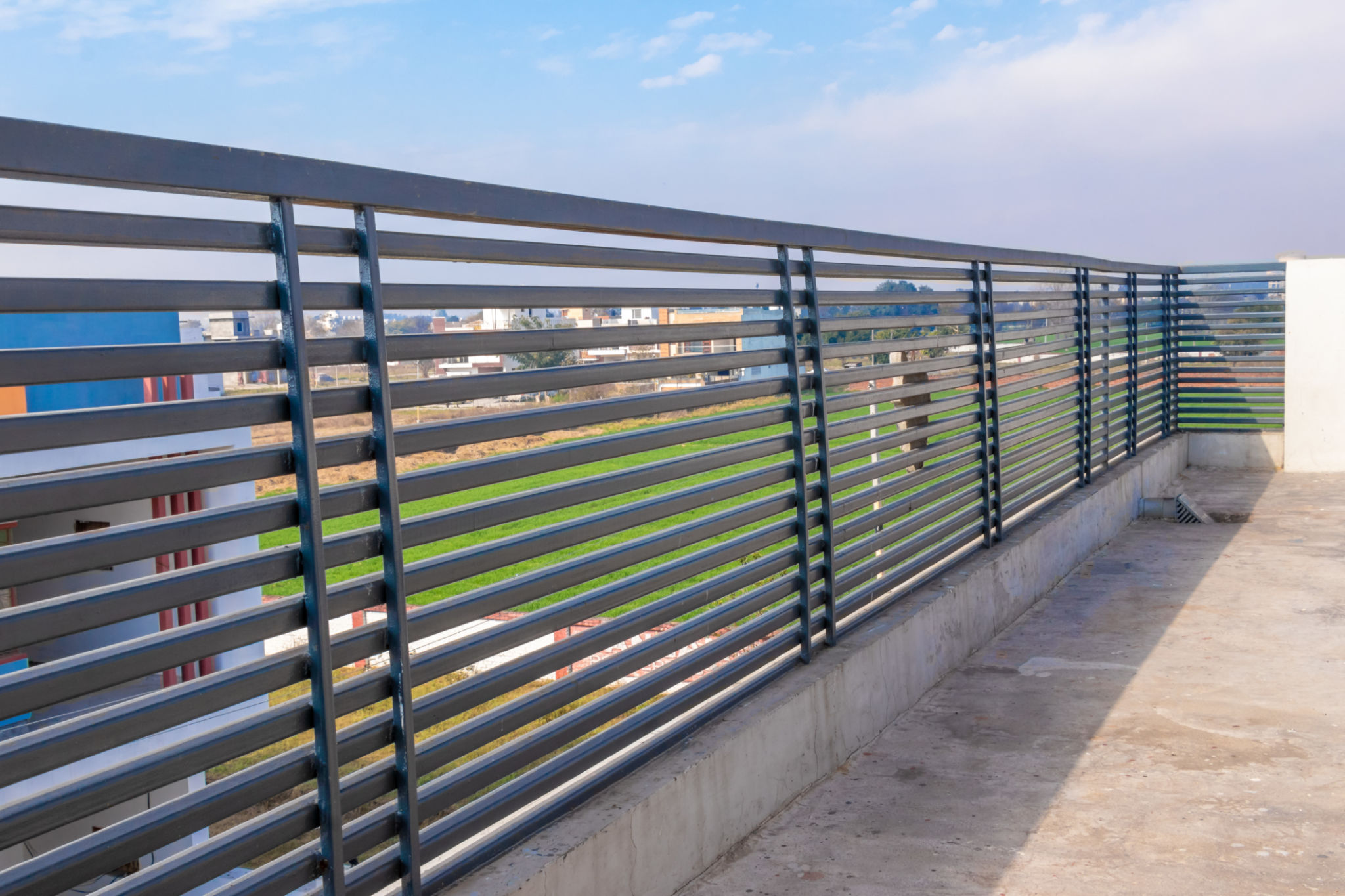 Steel railing on the house traces on blue sky background. Steel railing on the house traces on blue sky background.