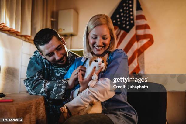 it's my job to keep you happy and well - military nurse stock pictures, royalty-free photos & images