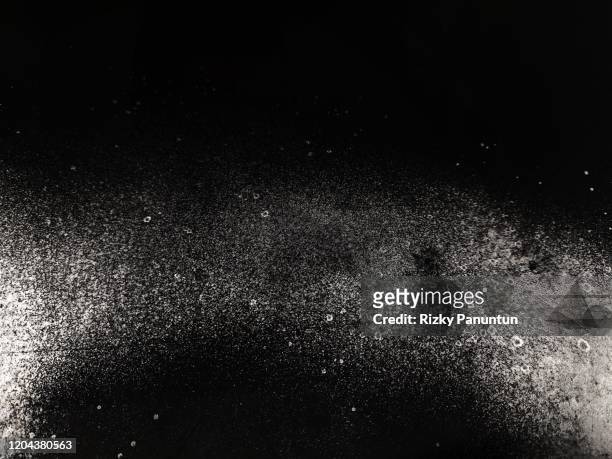 close-up of a white spray paint on black background - paint textures ストックフォトと画像