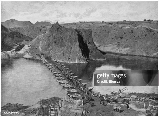 antique photograph of the british empire: the 72nd highlanders crossing the indus - indus valley stock illustrations