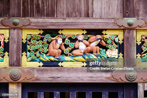 three wise monkeys famous wooden carving, japan - 3 wise monkeys stock-fotos und bilder