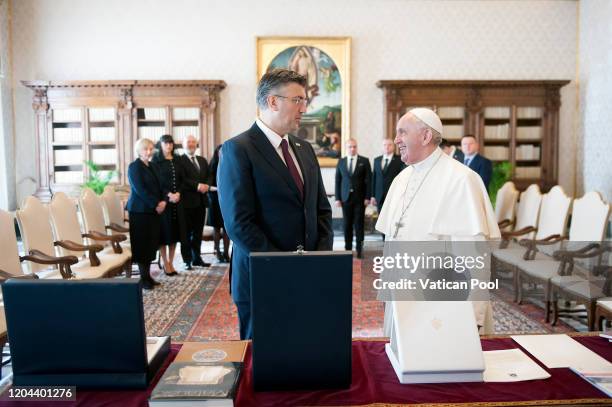 Pope Francis exchanges gifts with Croatia Prime Minister Andrej Plenkovic during an audience at the Apostolic Palace on February 06, 2020 in Vatican...