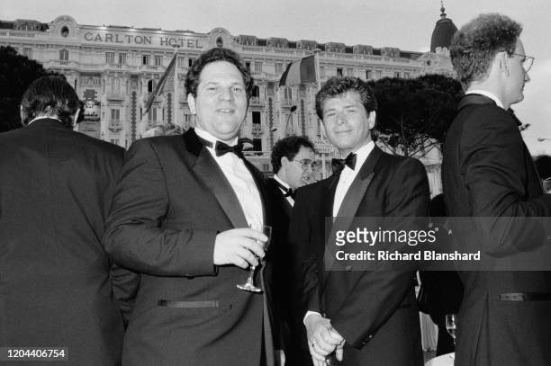 American film producer Harvey Weinstein and others at the 1989 Cannes Film Festival, outside the InterContinental Carlton Cannes Hotel, Cannes,...
