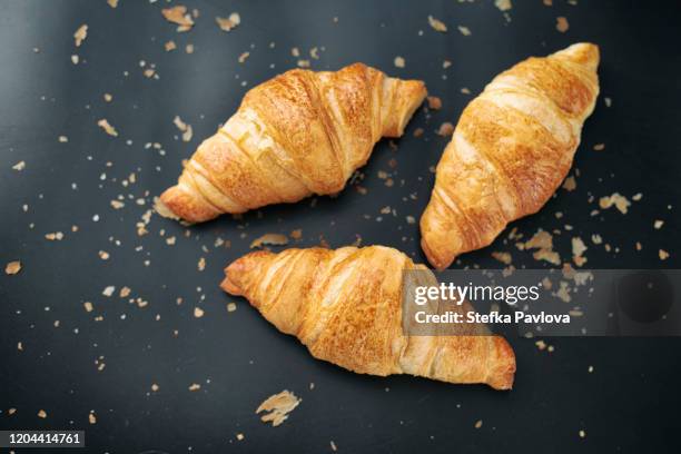 directly above shot of pile of croissants on table - miga fotografías e imágenes de stock