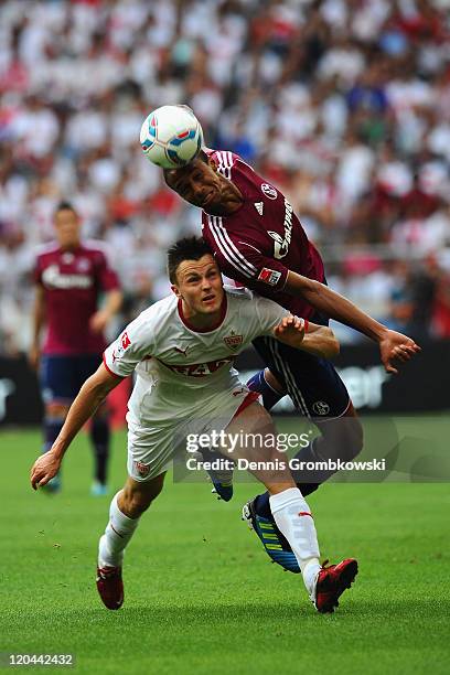 William Kvist of Stuttgart and Joel Matip of Schalke battle for the ball during the Bundesliga match between VfB Stuttgart and FC Schalke 04 at...