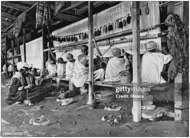 antique photograph of the british empire: carpet weaving in india - textile loom stock illustrations