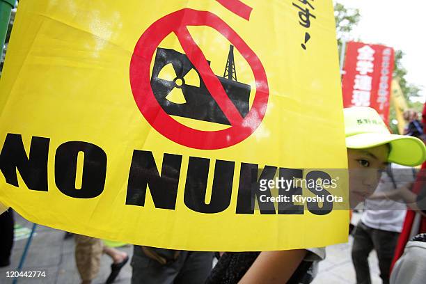 People take part in an anti-nuclear power protest on the 66th anniversary of the Hiroshima atomic bombing on August 6, 2011 in Hiroshima, Japan. The...