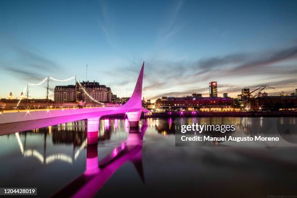 women's bridge at dusk, puerto madero, buenos aires, argentina - argentina sunset stock pictures, royalty-free photos & images