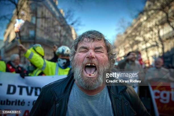 Members of the CGT Union march through Paris on the 9th inter-professional day of strikes and demonstration against President Macron’s controversial...
