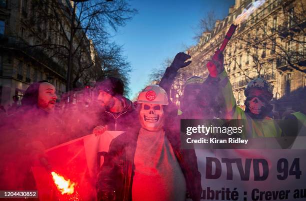 Members of the CGT Union march through Paris on the 9th inter-professional day of strikes and demonstration against President Macron’s controversial...