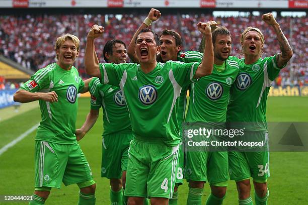 Marcel Schaefer of Wolfsburg celebrates the second goal with his team mates during the Bundesliga match between 1. FC Koeln and VfL Wolfsburg at...