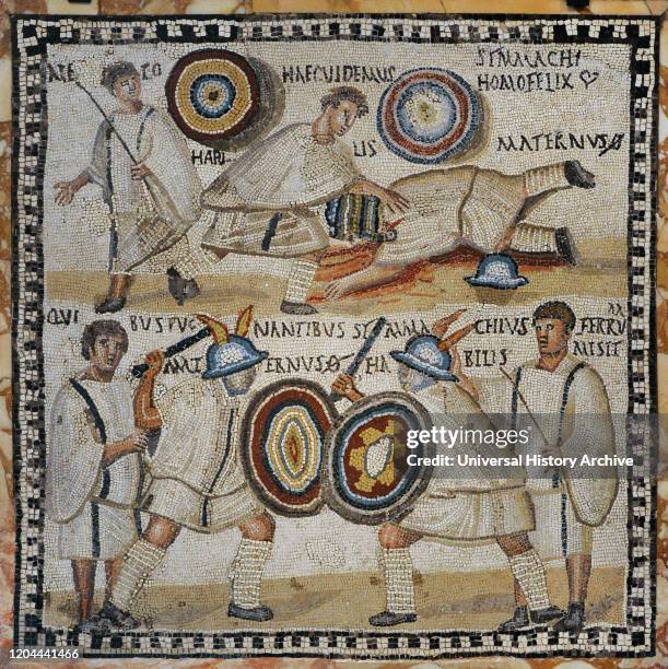 Roman mosaic depicting a Gladiator fight. In the lower part, the murmillones Symmanchus and Maternus are fighting in the arena cheered by the...