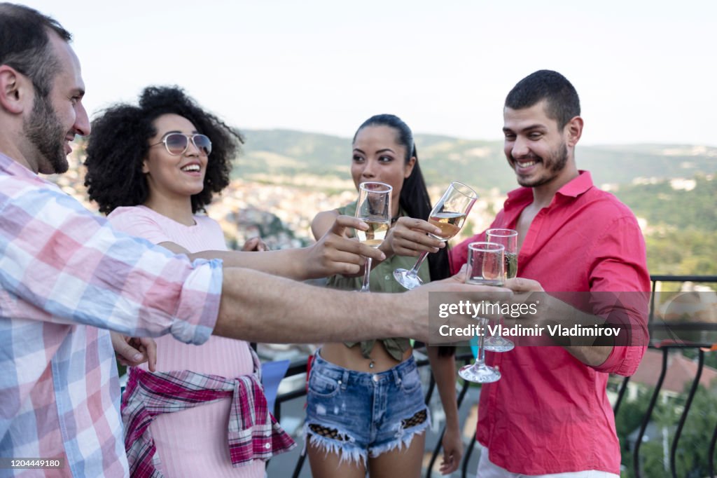 Friends celebrating at roof party