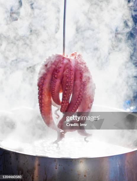 pulpo a feira - boiled octopus in fair - octopus food stock pictures, royalty-free photos & images