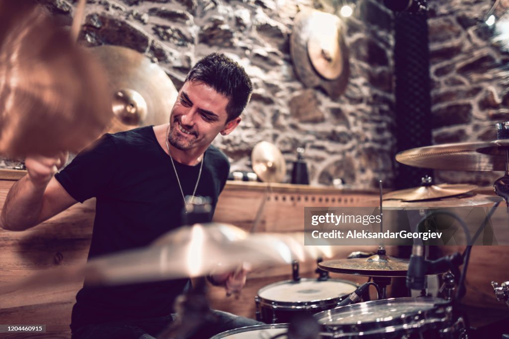 Drummer Hitting The Drums With Expert Precision